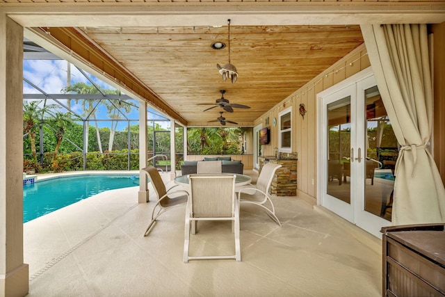 519 SE Brookside Ter, Port Saint Lucie, FL 34983 - view of patio / terrace featuring french doors, a ceiling fan, an outdoor pool, an outdoor hangout area, and outdoor dining space