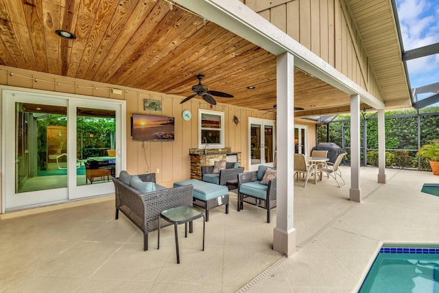 519 SE Brookside Ter, Port Saint Lucie, FL 34983 - view of patio / terrace with french doors, ceiling fan, outdoor lounge area, an outdoor pool, and grilling area