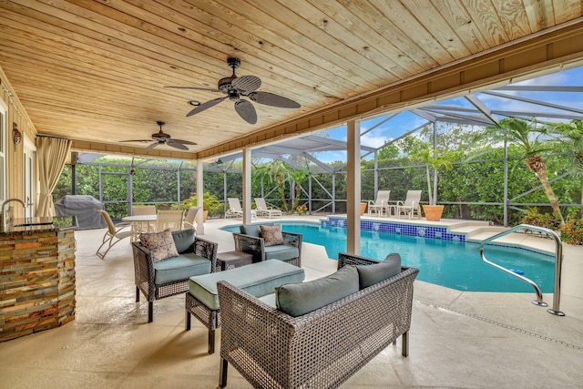 519 SE Brookside Ter, Port Saint Lucie, FL 34983 - swimming pool with a grill, an outdoor hangout area, a patio, and a lanai