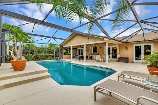 519 SE Brookside Ter, Port Saint Lucie, FL 34983 - swimming pool featuring french doors, a patio, a ceiling fan, and a lanai