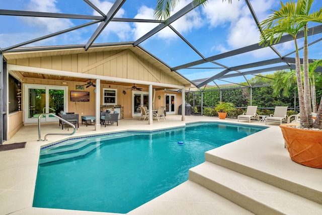 519 SE Brookside Ter, Port Saint Lucie, FL 34983 - outdoor pool with french doors, a ceiling fan, and a patio area