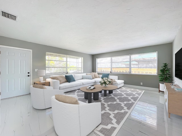 903 21st St, West Palm Beach, FL 33407 - living room with baseboards and a textured ceiling