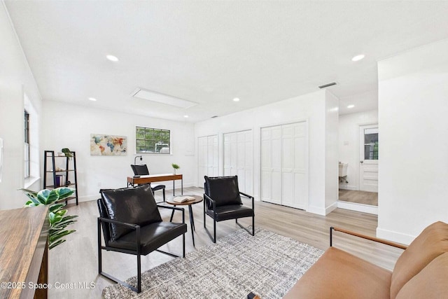 2318 Old Samsula Rd, Port Orange, FL 32128 - living room featuring light wood finished floors, recessed lighting, baseboards, and a desk