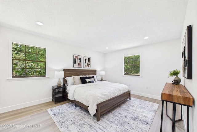 2318 Old Samsula Rd, Port Orange, FL 32128 - bedroom with light wood finished floors, baseboards, and recessed lighting
