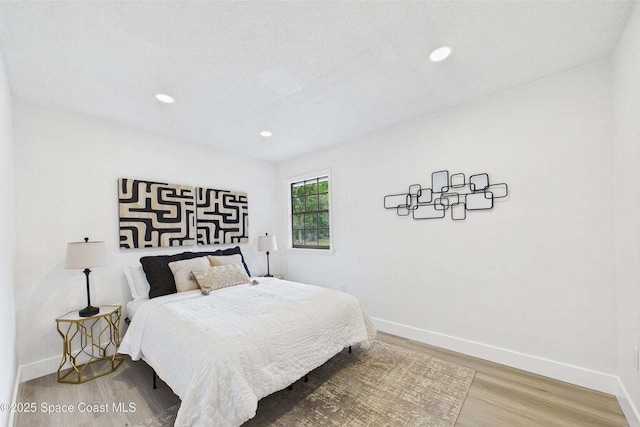 2318 Old Samsula Rd, Port Orange, FL 32128 - bedroom featuring wood finished floors, baseboards, and recessed lighting