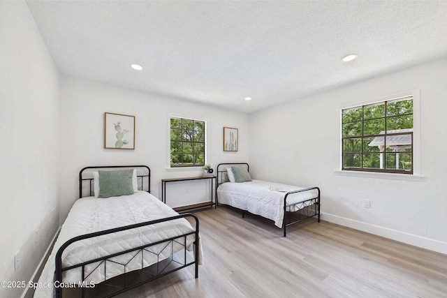 2318 Old Samsula Rd, Port Orange, FL 32128 - bedroom featuring light wood finished floors, baseboards, and recessed lighting