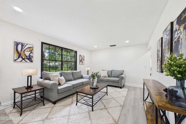 2318 Old Samsula Rd, Port Orange, FL 32128 - living room featuring wood finished floors, recessed lighting, and baseboards