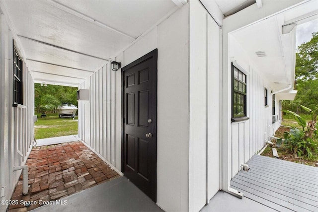 2318 Old Samsula Rd, Port Orange, FL 32128 - view of exterior entry featuring board and batten siding