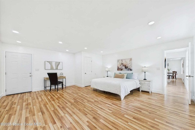 2318 Old Samsula Rd, Port Orange, FL 32128 - bedroom featuring light wood-type flooring, recessed lighting, and baseboards