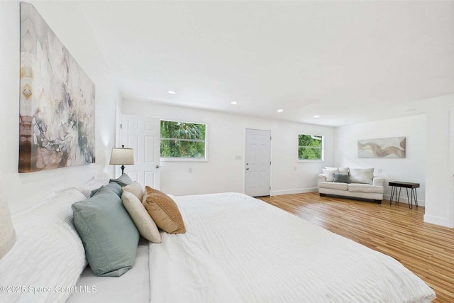 2318 Old Samsula Rd, Port Orange, FL 32128 - bedroom featuring wood finished floors, recessed lighting, and baseboards