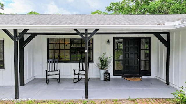2318 Old Samsula Rd, Port Orange, FL 32128 - property entrance featuring roof with shingles and a porch