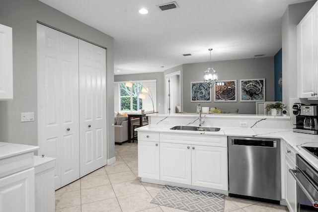 2381 SW Island Creek Trl, Palm City, FL 34990 - kitchen featuring stainless steel dishwasher, a sink, oven, a peninsula, and white cabinets