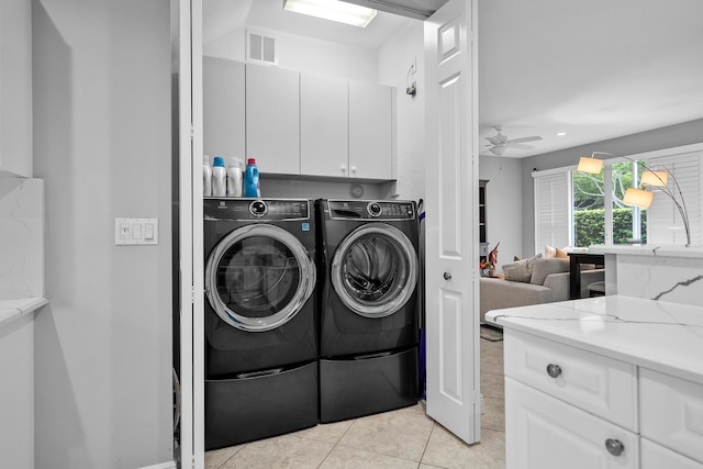 2381 SW Island Creek Trl, Palm City, FL 34990 - washroom featuring cabinet space, washer and clothes dryer, light tile patterned floors, and a ceiling fan