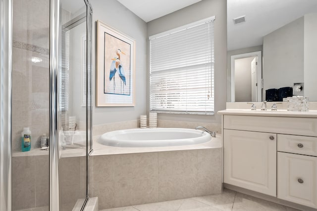 2381 SW Island Creek Trl, Palm City, FL 34990 - full bathroom with vanity, a bath, tile patterned flooring, and a stall shower