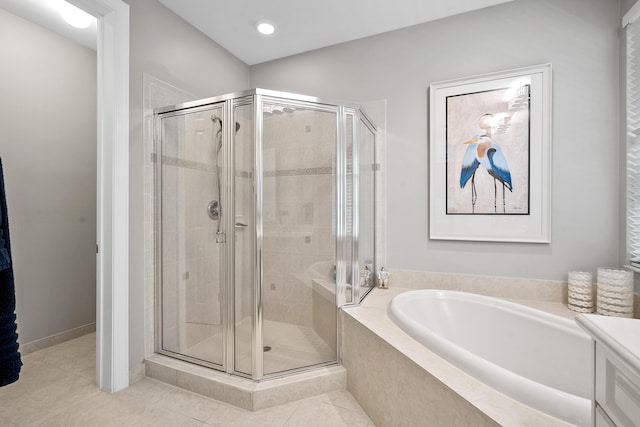 2381 SW Island Creek Trl, Palm City, FL 34990 - bathroom featuring a bath, a shower stall, tile patterned floors, and recessed lighting