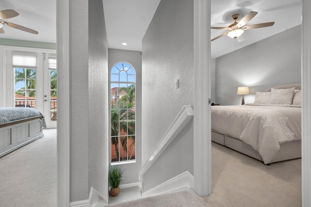 2381 SW Island Creek Trl, Palm City, FL 34990 - bedroom with a textured wall, carpet floors, access to outside, and ceiling fan