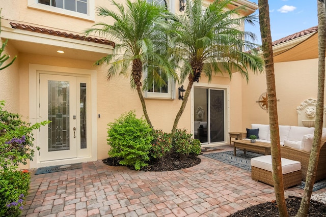 2381 SW Island Creek Trl, Palm City, FL 34990 - entrance to property featuring stucco siding and a patio area