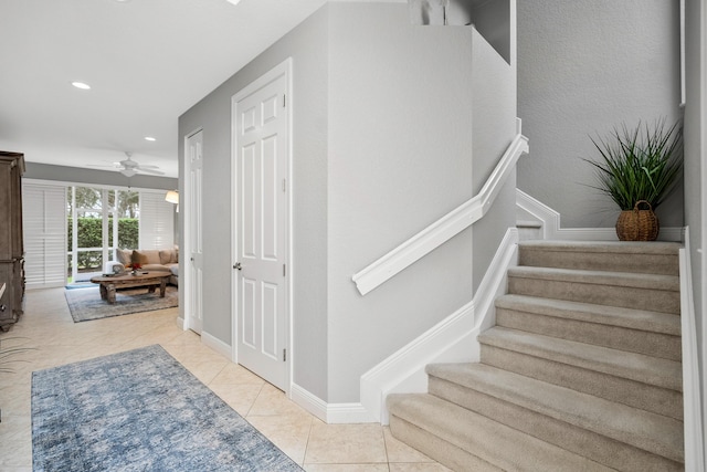 2381 SW Island Creek Trl, Palm City, FL 34990 - stairway with ceiling fan, recessed lighting, and tile patterned flooring