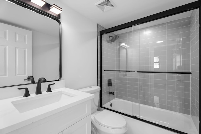 7420 S Ocean Dr Unit 314, Jensen Beach, FL 34957 - full bathroom featuring toilet, vanity, and enclosed tub / shower combo