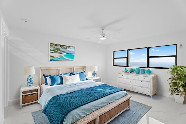 7420 S Ocean Dr Unit 314, Jensen Beach, FL 34957 - bedroom featuring light marble finish floors, baseboards, and a ceiling fan