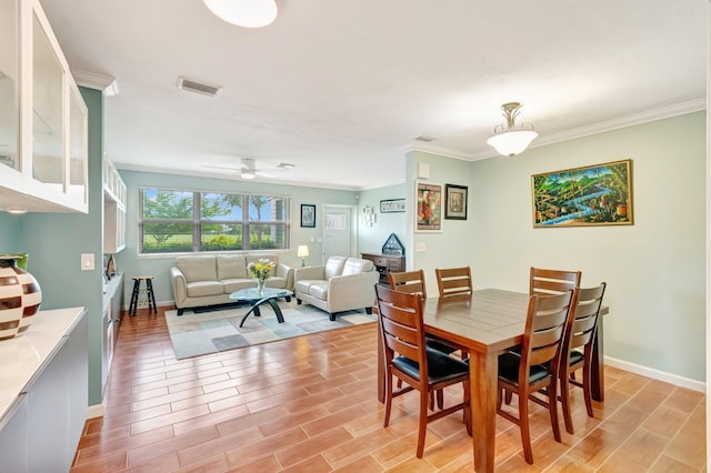 320 Summa St, West Palm Beach, FL 33405 - dining room featuring ornamental molding, baseboards, ceiling fan, and light wood finished floors