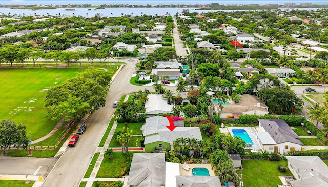 320 Summa St, West Palm Beach, FL 33405 - aerial perspective of suburban area with a pool area and a nearby body of water