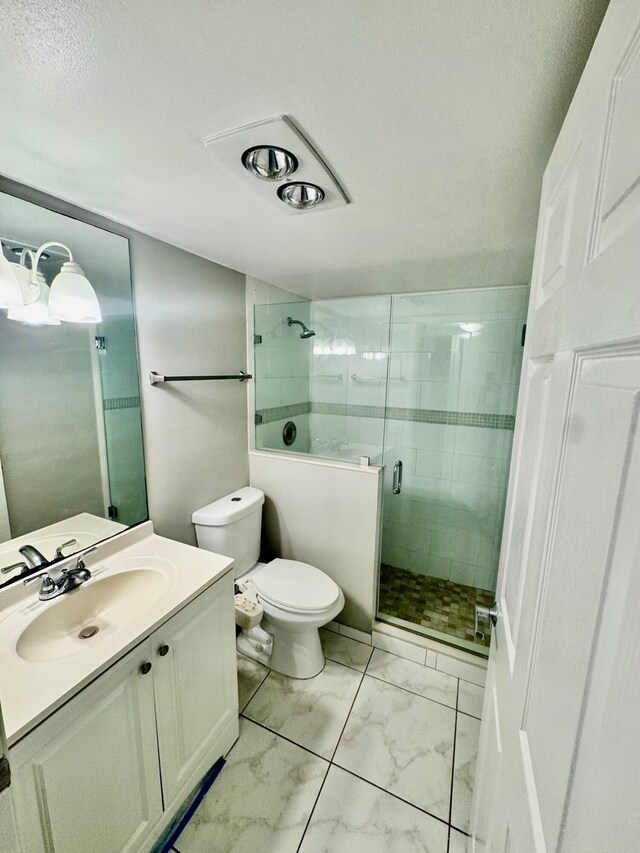 200 Village Green Cir E Unit 102, Palm Springs, FL 33461 - full bath featuring marble finish flooring, vanity, toilet, a stall shower, and a textured ceiling