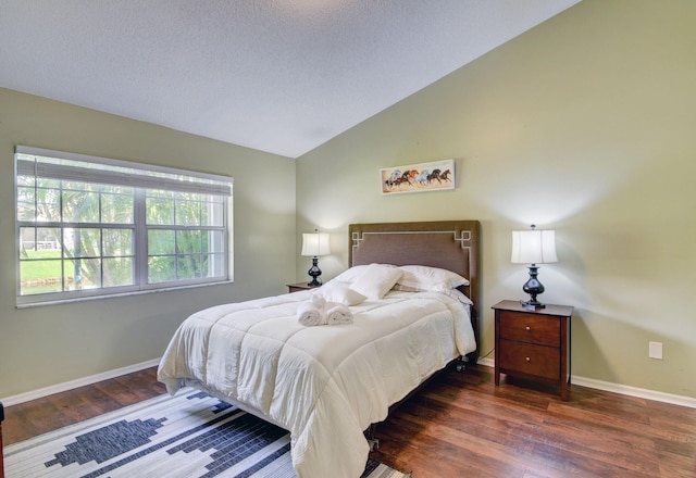 13134 Quiet Woods Rd Unit A, Wellington, FL 33414 - bedroom featuring wood finished floors, baseboards, vaulted ceiling, and a textured ceiling