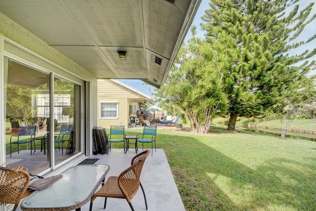 13134 Quiet Woods Rd Unit A, Wellington, FL 33414 - view of green lawn with a patio