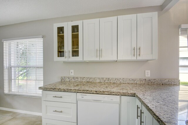13134 Quiet Woods Rd Unit A, Wellington, FL 33414 - kitchen featuring dishwasher, white cabinets, glass insert cabinets, and healthy amount of natural light