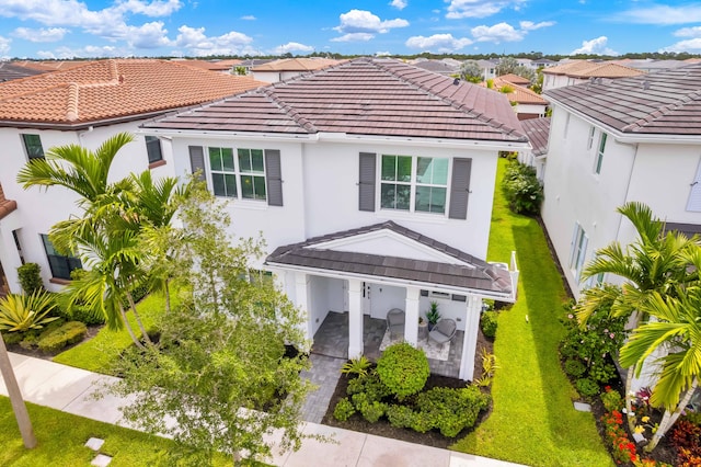 13330 Machiavelli Way, Palm Beach Gardens, FL 33418 - view of front of house featuring a tile roof, stucco siding, and a residential view