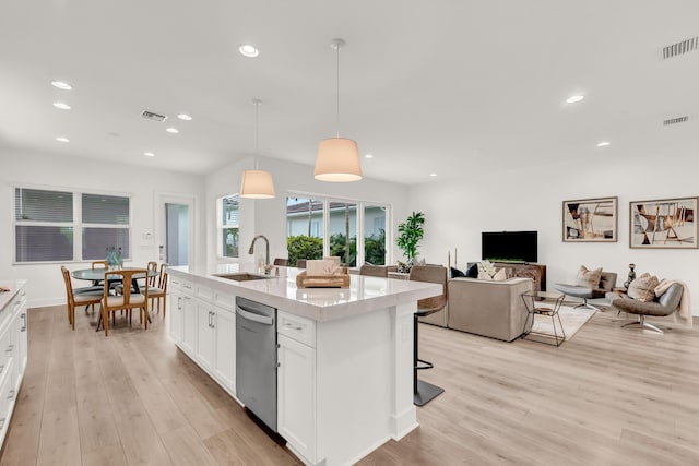 13330 Machiavelli Way, Palm Beach Gardens, FL 33418 - kitchen with a sink, dishwasher, light wood-type flooring, white cabinetry, and recessed lighting