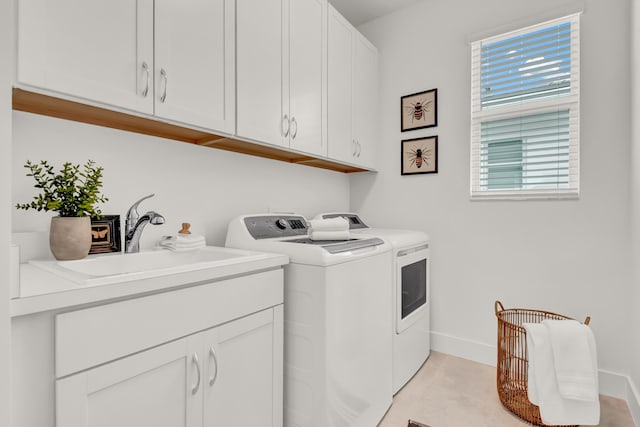 13330 Machiavelli Way, Palm Beach Gardens, FL 33418 - washroom with washing machine and clothes dryer, cabinet space, and baseboards