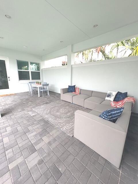 13330 Machiavelli Way, Palm Beach Gardens, FL 33418 - view of patio / terrace featuring outdoor dining area and an outdoor hangout area