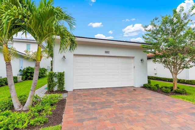 13330 Machiavelli Way, Palm Beach Gardens, FL 33418 - garage featuring decorative driveway