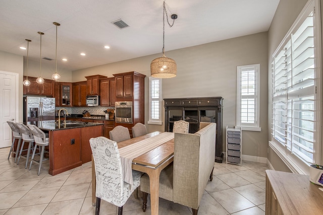 10295 SW Waterway Ln, Port Saint Lucie, FL 34987 - dining room featuring light tile patterned floors and recessed lighting