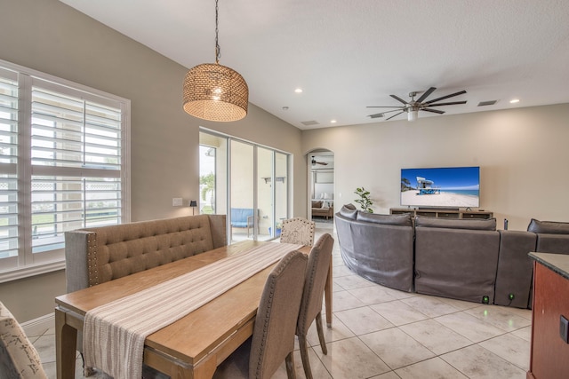 10295 SW Waterway Ln, Port Saint Lucie, FL 34987 - dining space featuring arched walkways, a ceiling fan, light tile patterned floors, and recessed lighting