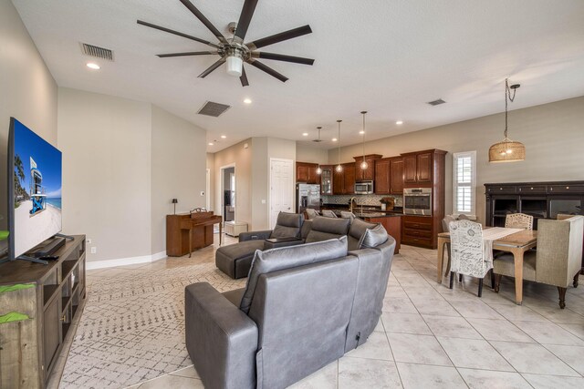 10295 SW Waterway Ln, Port Saint Lucie, FL 34987 - living area featuring light tile patterned flooring, recessed lighting, and ceiling fan