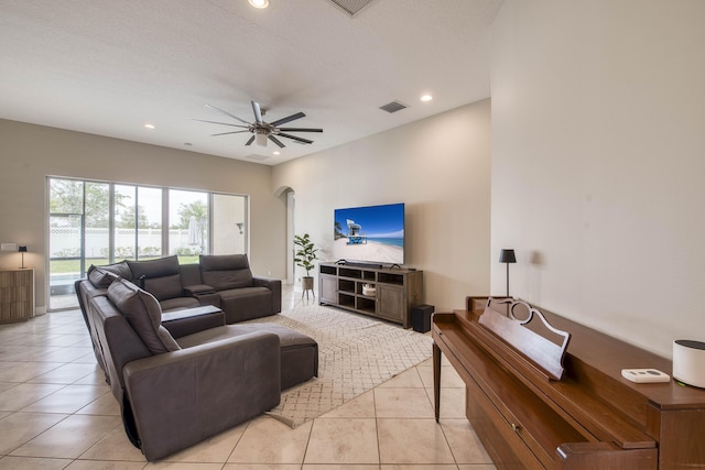 10295 SW Waterway Ln, Port Saint Lucie, FL 34987 - living room featuring a ceiling fan, arched walkways, light tile patterned flooring, and recessed lighting