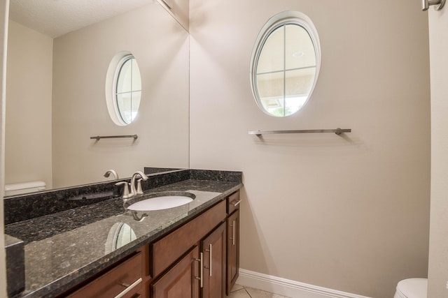 10295 SW Waterway Ln, Port Saint Lucie, FL 34987 - half bath featuring vanity, tile patterned flooring, and a textured ceiling