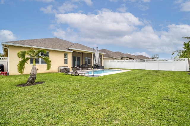 10295 SW Waterway Ln, Port Saint Lucie, FL 34987 - rear view of property featuring stucco siding, a fenced backyard, a sunroom, and a ceiling fan