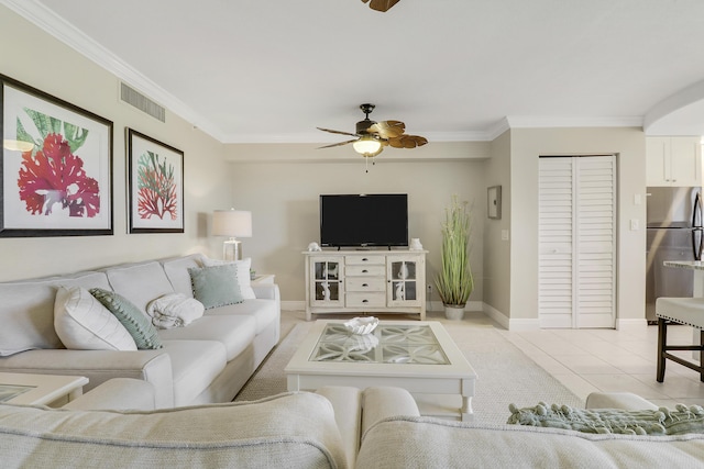 275 Palm Ave Unit A406, Jupiter, FL 33477 - living area with ceiling fan, ornamental molding, and light tile patterned floors