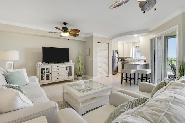 275 Palm Ave Unit A406, Jupiter, FL 33477 - living area featuring a ceiling fan, crown molding, and light tile patterned floors
