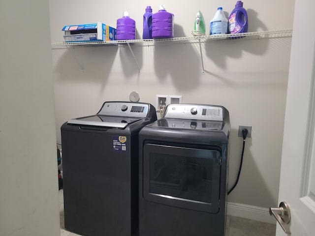 4019 Cascade Falls Cir, Lake Worth, FL 33467 - laundry area featuring separate washer and dryer and tile patterned flooring