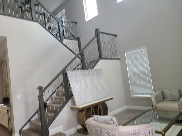 4019 Cascade Falls Cir, Lake Worth, FL 33467 - stairway featuring a high ceiling and carpet floors