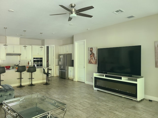 4019 Cascade Falls Cir, Lake Worth, FL 33467 - living area featuring a ceiling fan and wood finished floors