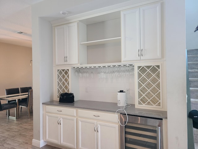 4019 Cascade Falls Cir, Lake Worth, FL 33467 - indoor dry bar featuring wine cooler, decorative backsplash, stairs, and light wood finished floors