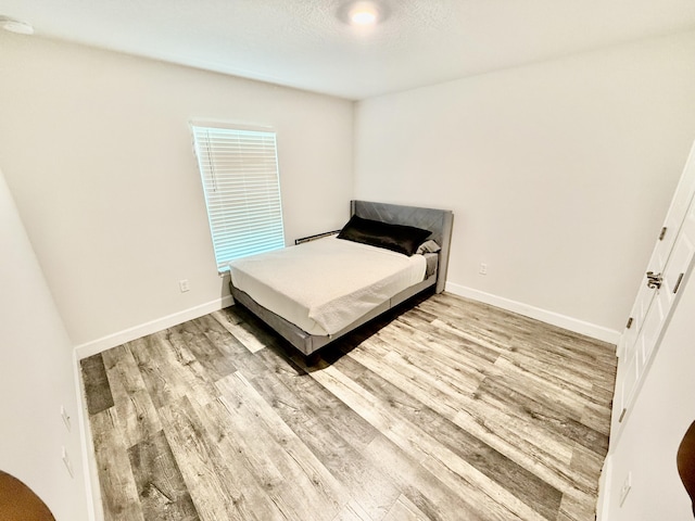 4480 SW Jaunt Rd, Port Saint Lucie, FL 34953 - bedroom featuring wood finished floors and baseboards
