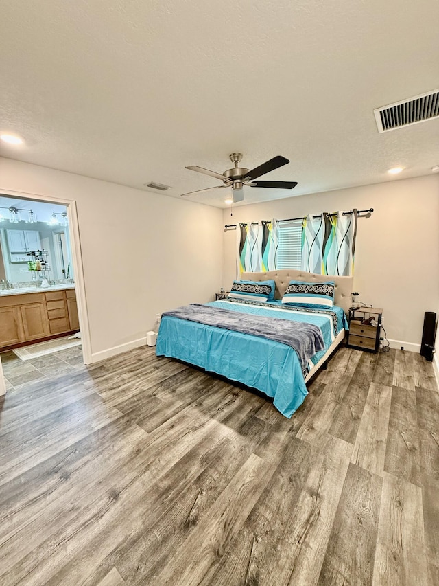 4480 SW Jaunt Rd, Port Saint Lucie, FL 34953 - bedroom with light wood finished floors, baseboards, and ensuite bathroom
