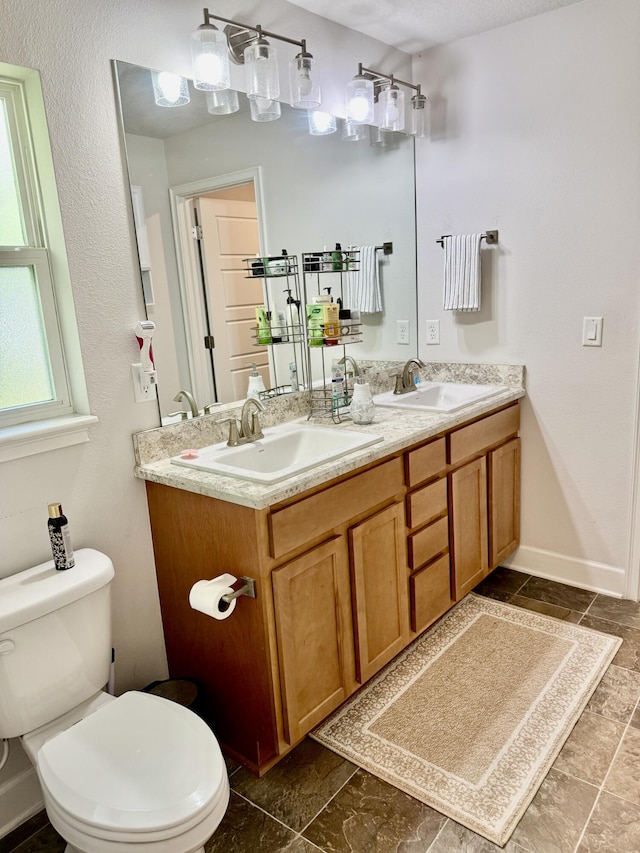 4480 SW Jaunt Rd, Port Saint Lucie, FL 34953 - bathroom with double vanity and toilet